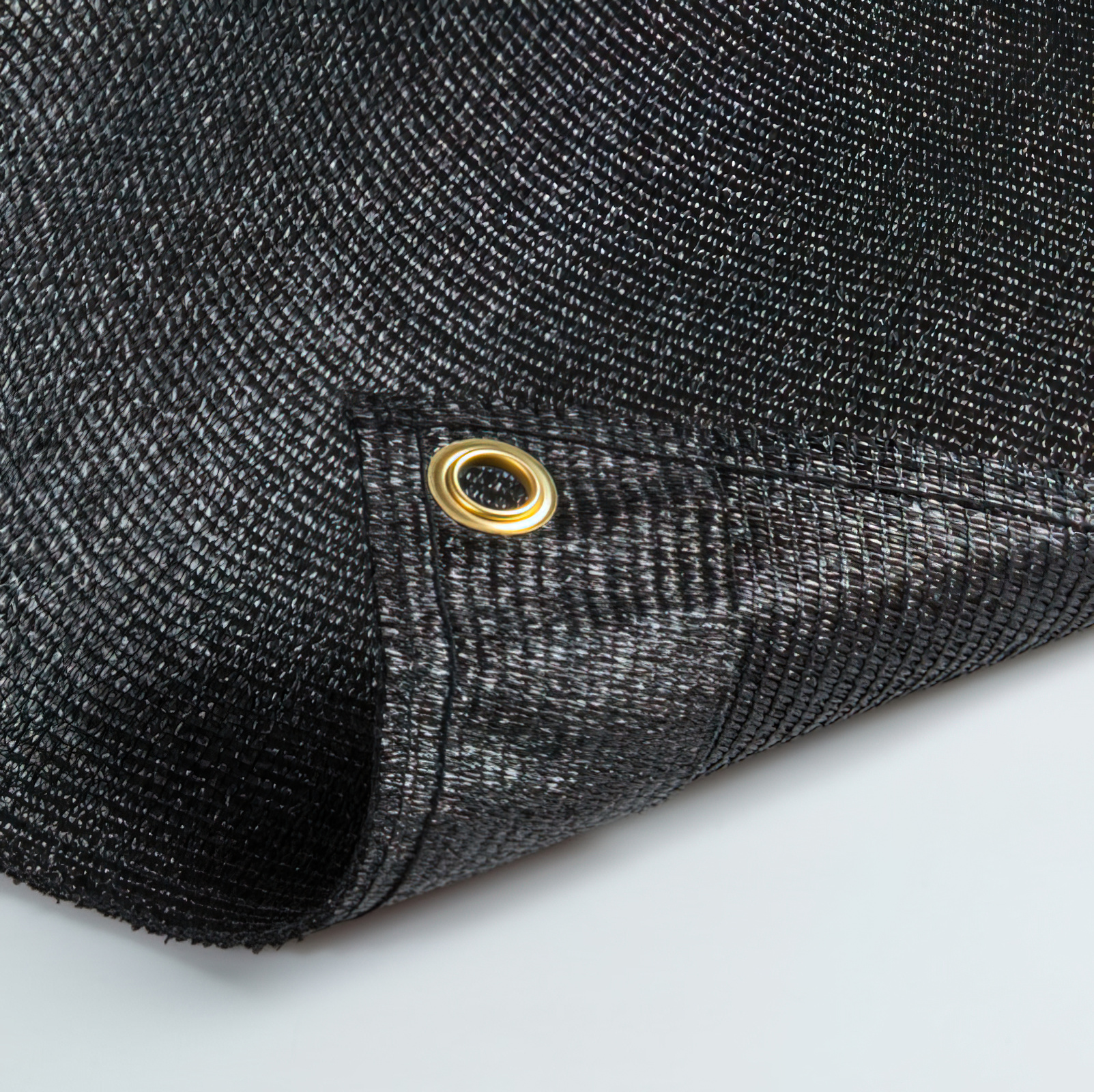 Toile brise-vue en rouleau avec œillets